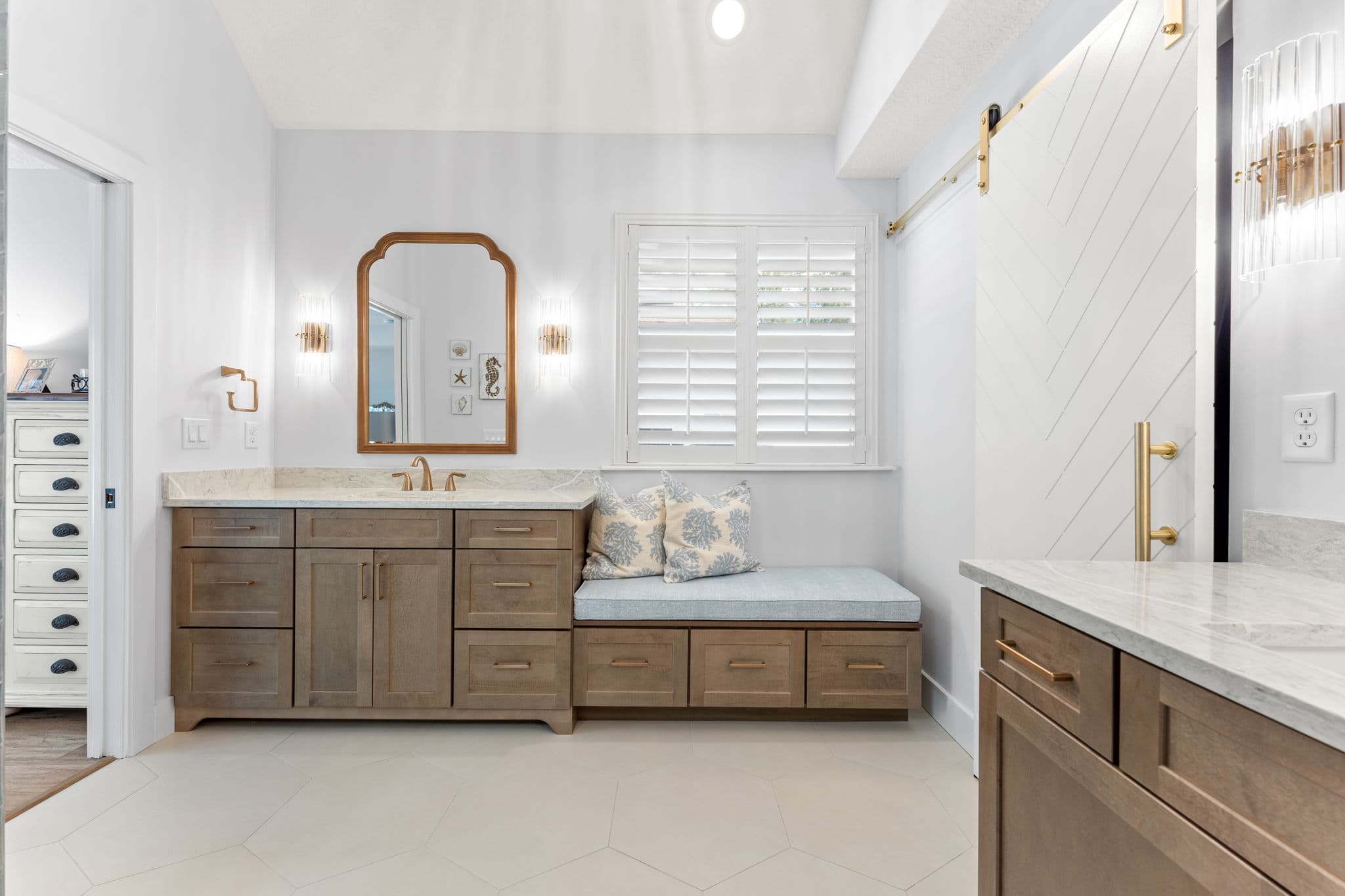 Bathroom remodel with updated tile, fixtures, and cabinetry
